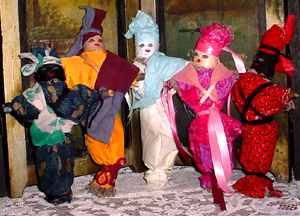 Five Hand Crafted Original New Orleans Voodoo Dolls displayed on a table